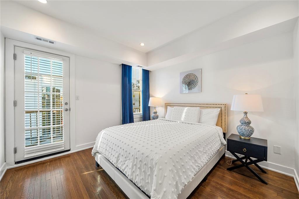 2840 Peachtree Road Northwest, Unit 502 Atlanta, GA 30305 - Photo 12 of 27 a bedroom with a bed and a window