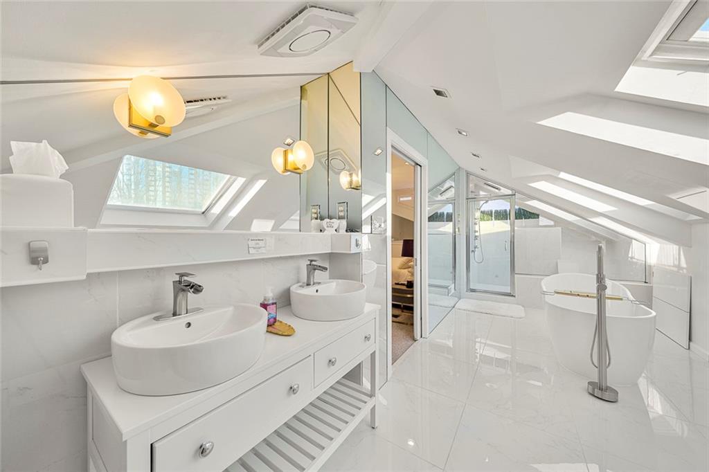2840 Peachtree Road Northwest, Unit 502 Atlanta, GA 30305 - Photo 20 of 27 a bathroom with a sink and a mirror
