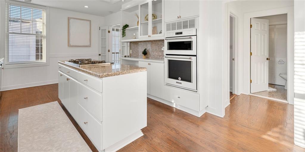 2840 Peachtree Road Northwest, Unit 502 Atlanta, GA 30305 - Photo 7 of 27 a kitchen with stainless steel appliances granite countertop a stove and a refrigerator