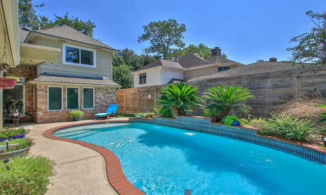 a house with garden in front of it
