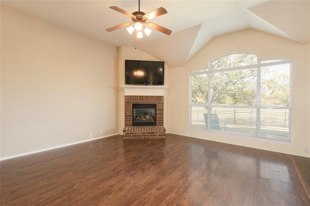 2104 Trinity Lane McKinney, TX 75072 - Photo 21 of 40 Spacious living room with cozy fireplace