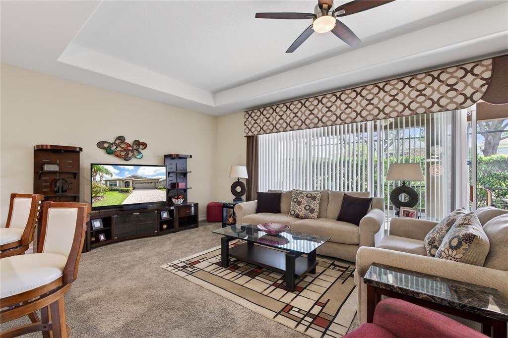 3651 Limestone Street Clermont, FL 34711 - Photo 11 of 41 a living room with furniture and a flat screen tv