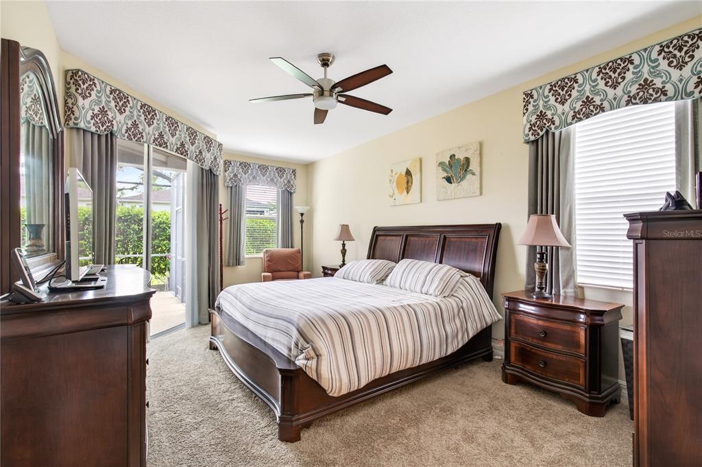 3651 Limestone Street Clermont, FL 34711 - Photo 14 of 41 a bedroom with a bed and a large window