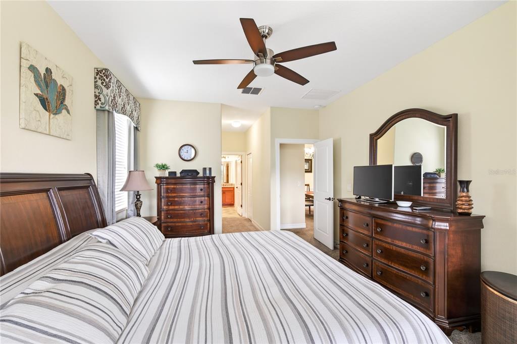 3651 Limestone Street Clermont, FL 34711 - Photo 15 of 41 a bedroom with a bed and a flat screen tv