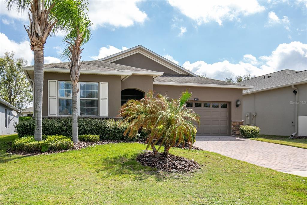 3651 Limestone Street Clermont, FL 34711 - Photo 2 of 41 a front view of a house with garden