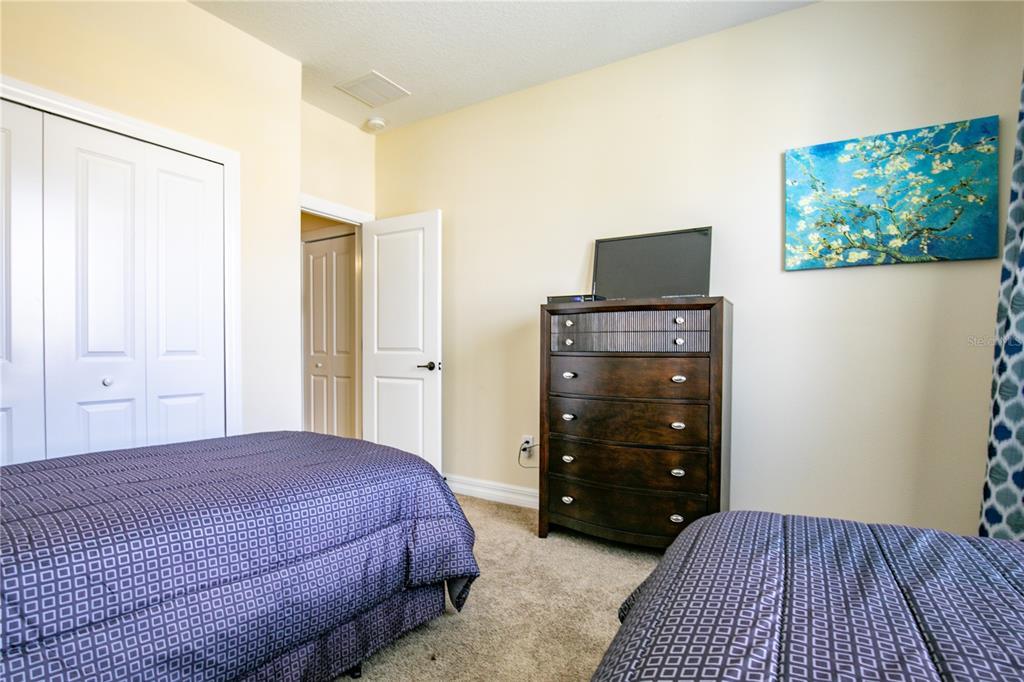 3651 Limestone Street Clermont, FL 34711 - Photo 24 of 41 a bedroom with a bed and a television