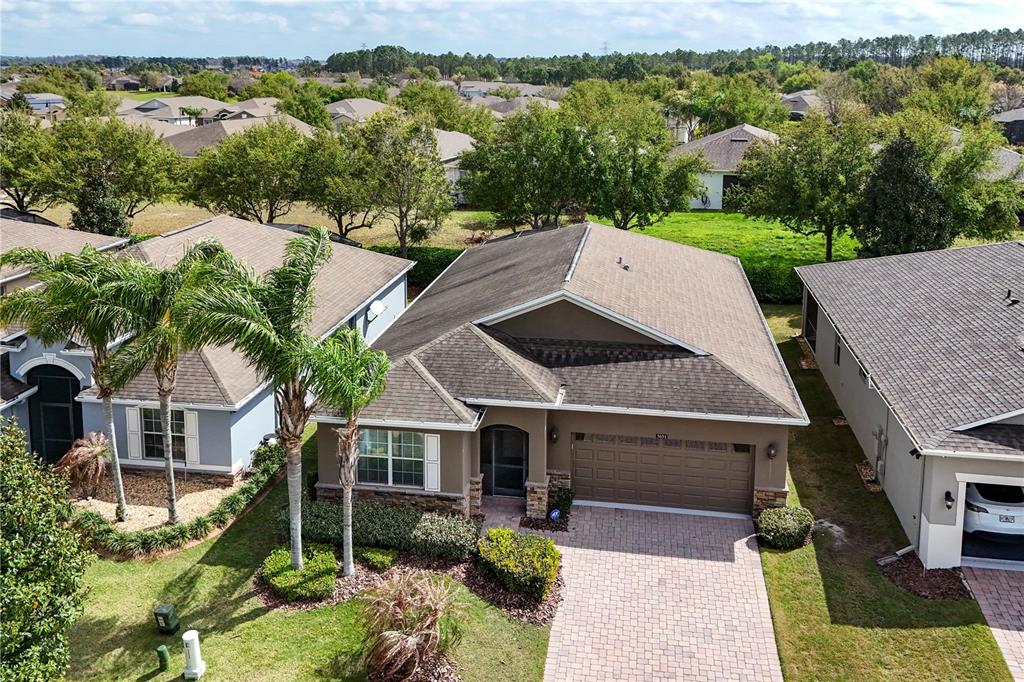 3651 Limestone Street Clermont, FL 34711 - Photo 29 of 41 an aerial view of a house with a yard