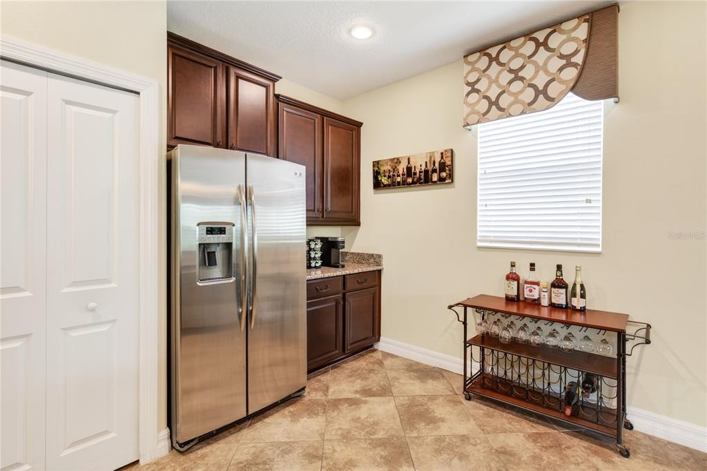 3651 Limestone Street Clermont, FL 34711 - Photo 6 of 41 a kitchen with a refrigerator and a stove