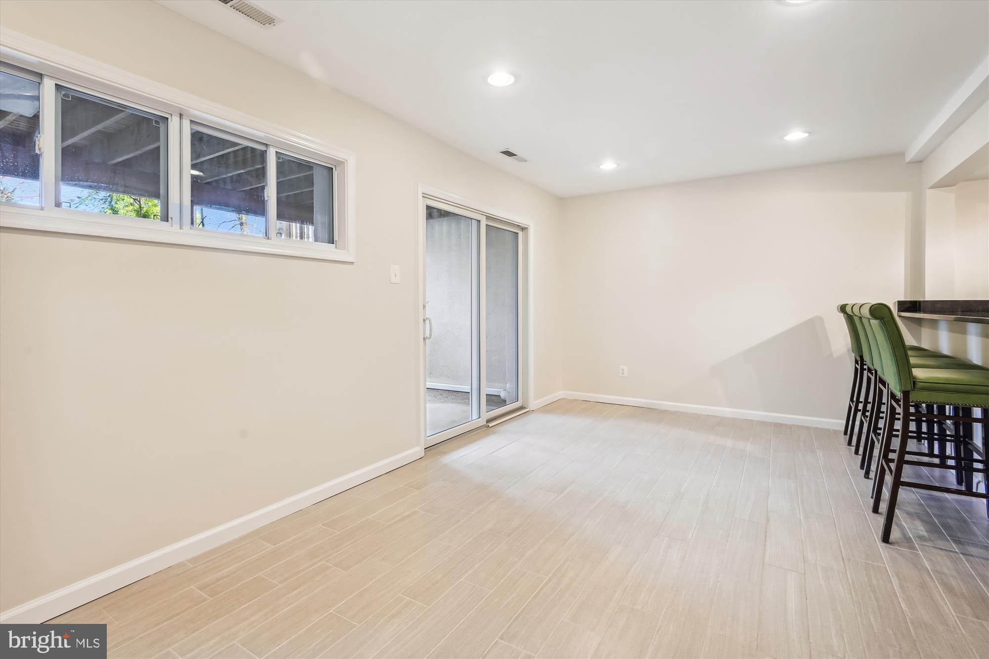 1640 Valencia Way Reston, VA 20190 - Photo 28 of 53 Sliding glass doors lead to lower level patio