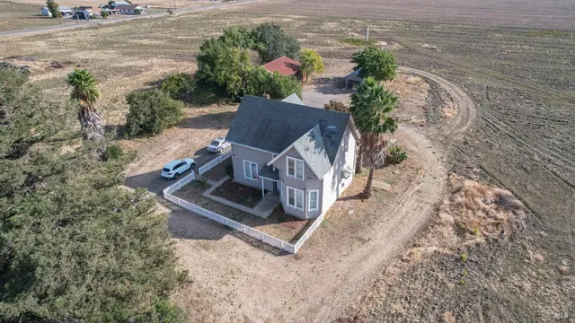 an aerial view of houses with outdoor space