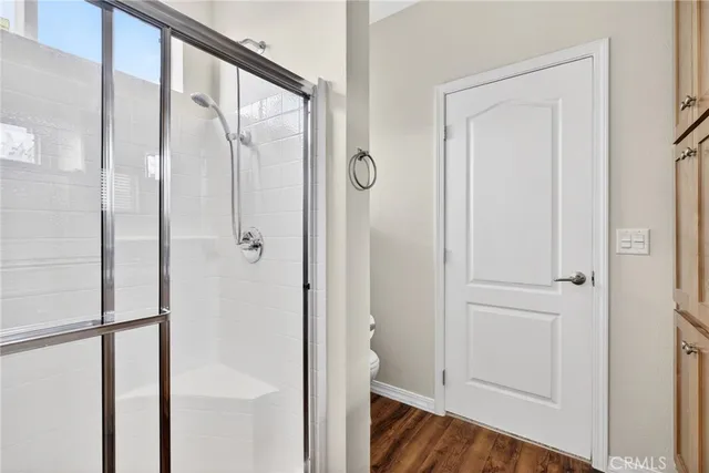 a bathroom with a glass shower door