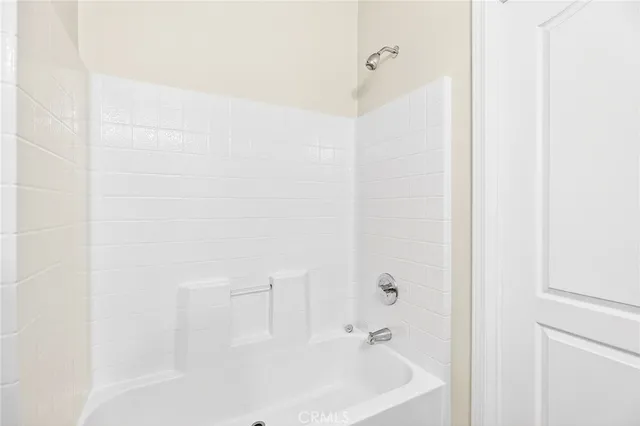 a bathroom with a white bath tub