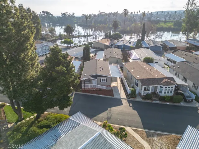 an aerial view of a house with a garden and deck