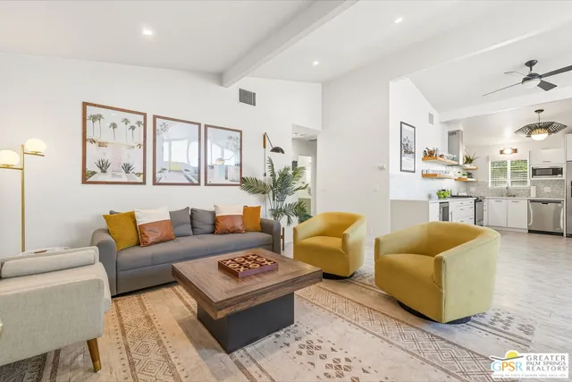 a living room with furniture and a rug