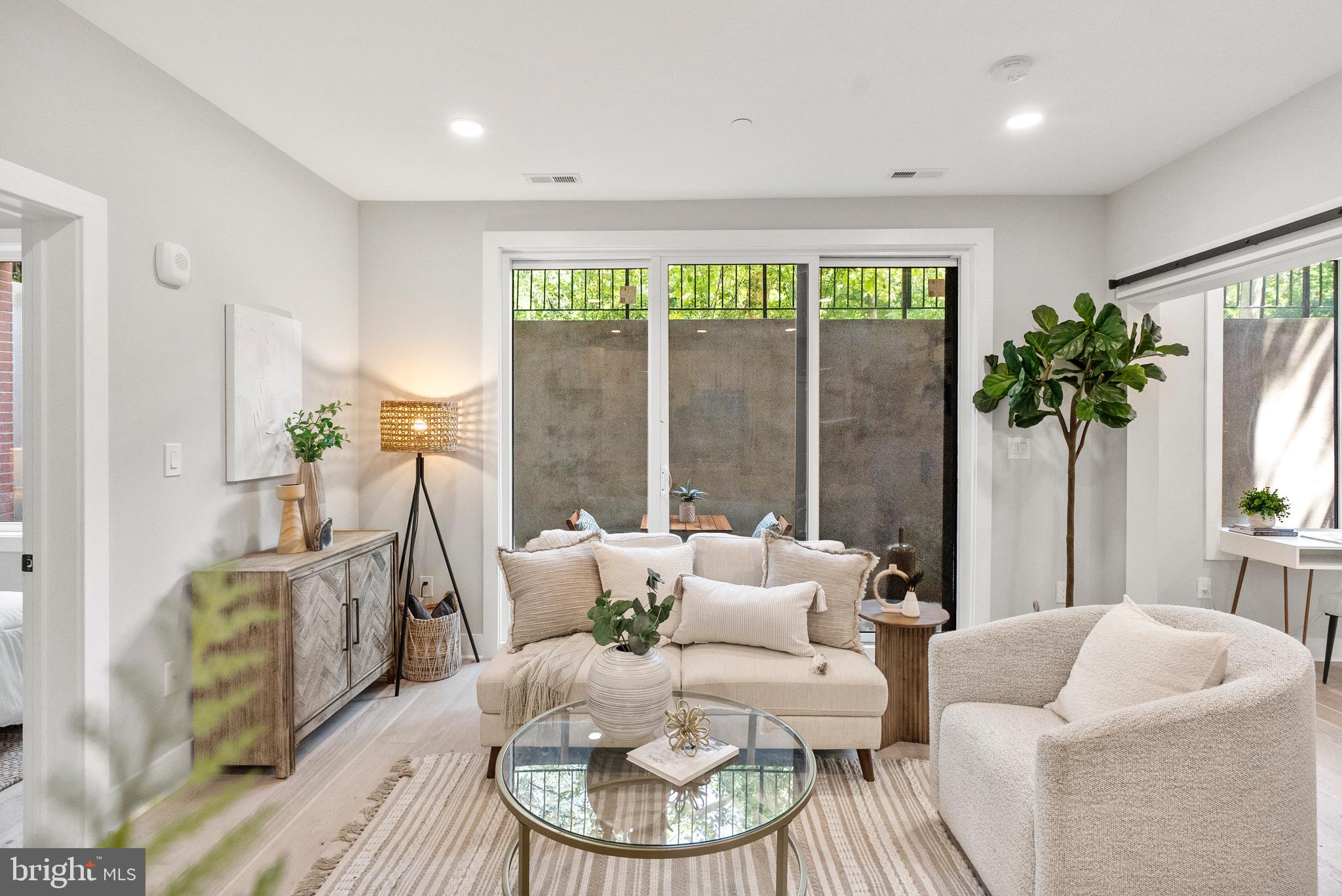 2019 M Street Northeast, Unit 1 Washington, DC 20002 - Photo 8 of 31 a living room with furniture and a large window