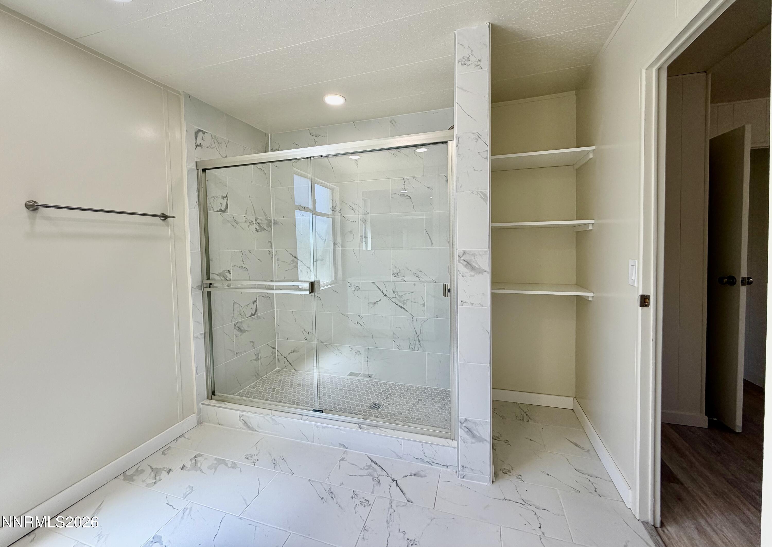 330 Taurus Circle Reno, NV 89521 - Photo 23 of 27 a bathroom with a glass shower door