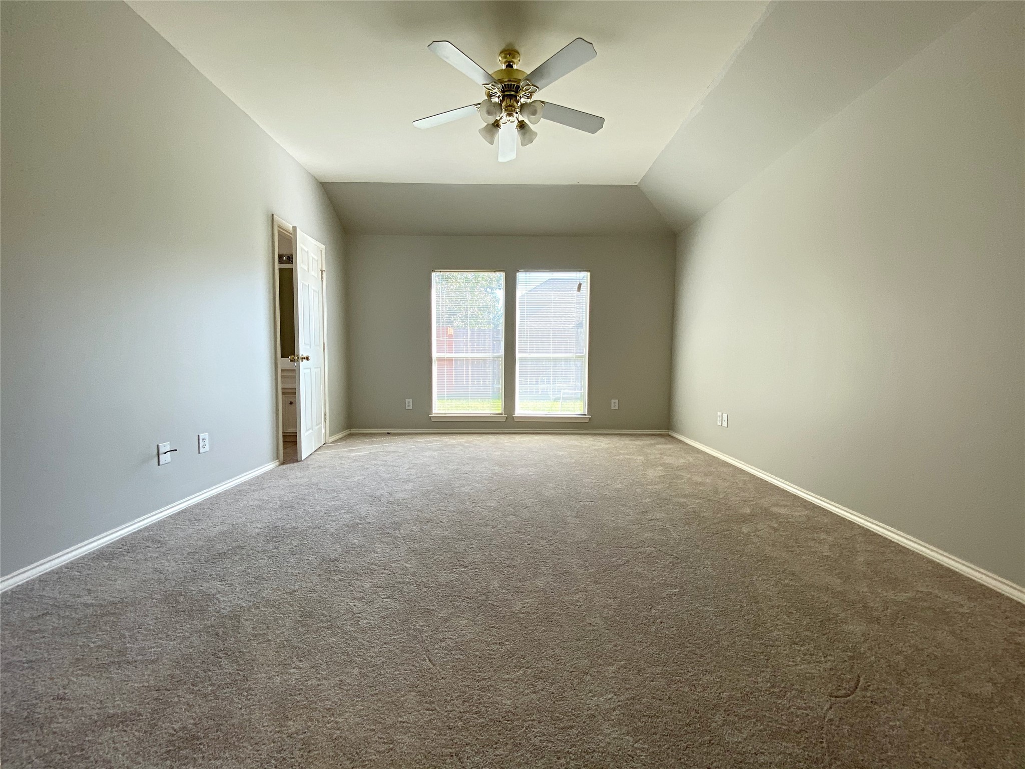 22014 Gold Leaf Trail Cypress, TX 77433 - Photo 16 of 25 an empty room with a window and a ceiling fan