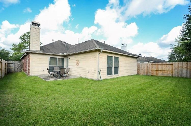 22014 Gold Leaf Trail Cypress, TX 77433 - Photo 24 of 25 a view of a house with backyard and garden