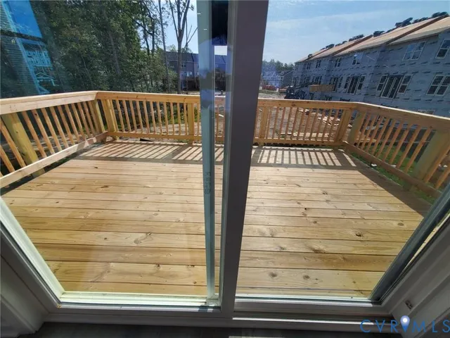 a view of balcony with wooden floor