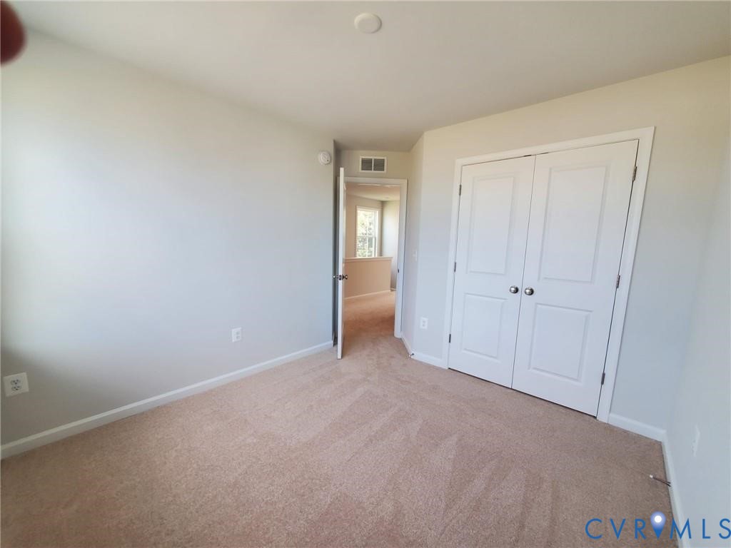 8833 Foxway Ridge Lane Glen Allen, VA 23060 - Photo 17 of 27 a view of an empty room and window