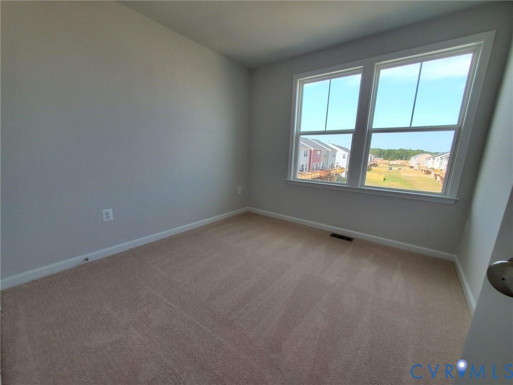 8833 Foxway Ridge Lane Glen Allen, VA 23060 - Photo 18 of 27 an empty room with a window
