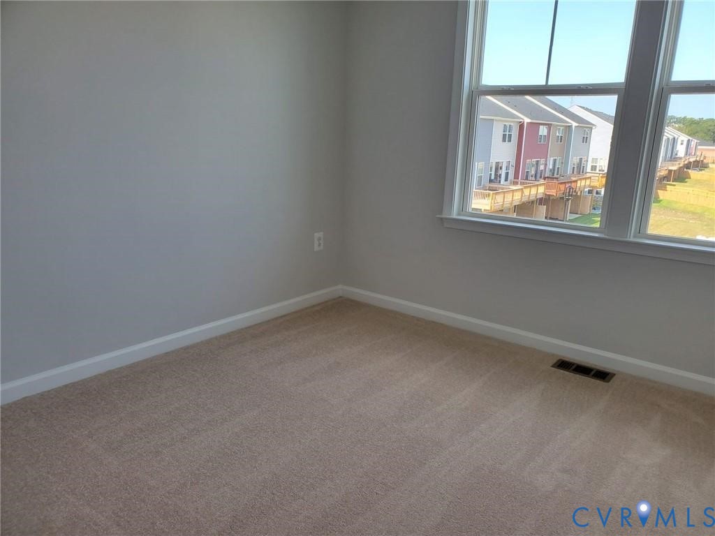 8833 Foxway Ridge Lane Glen Allen, VA 23060 - Photo 19 of 27 a view of an empty room with a window