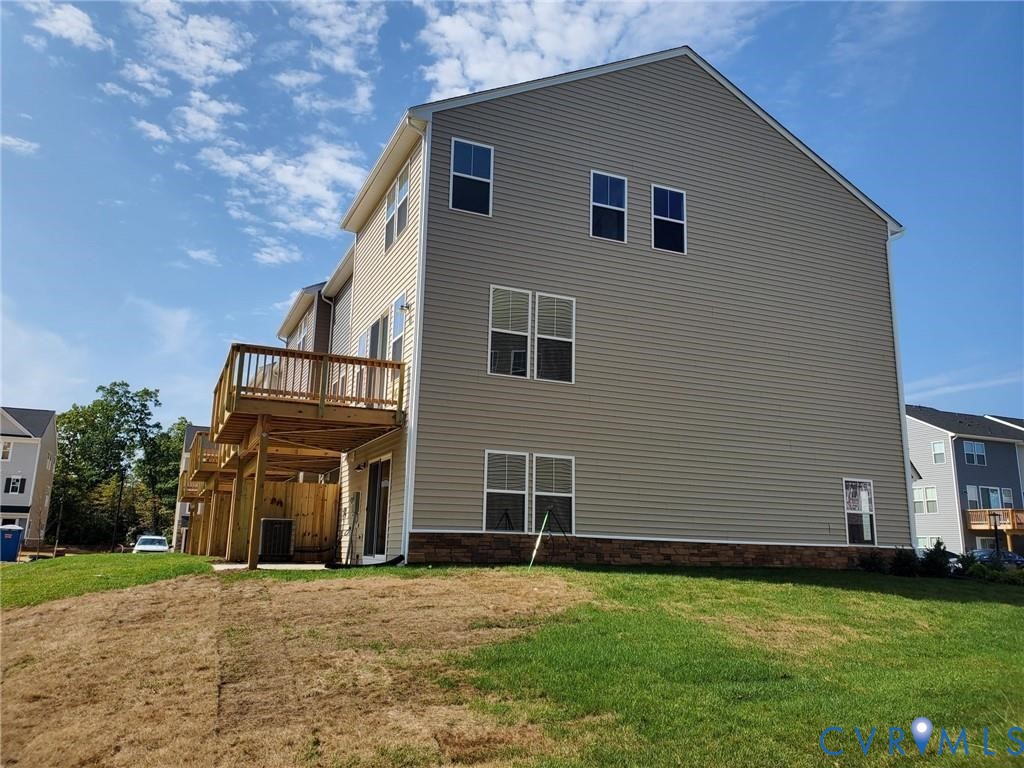 8833 Foxway Ridge Lane Glen Allen, VA 23060 - Photo 26 of 27 a front view of a house with a yard