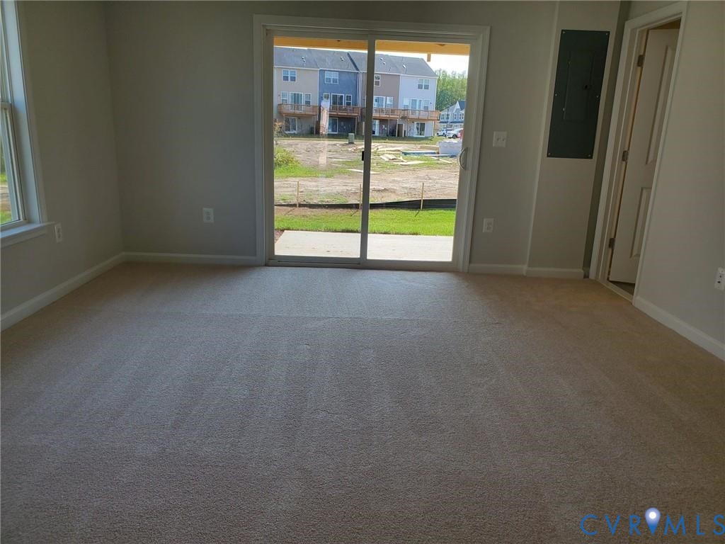 8833 Foxway Ridge Lane Glen Allen, VA 23060 - Photo 3 of 27 a view of an empty room with a sliding door