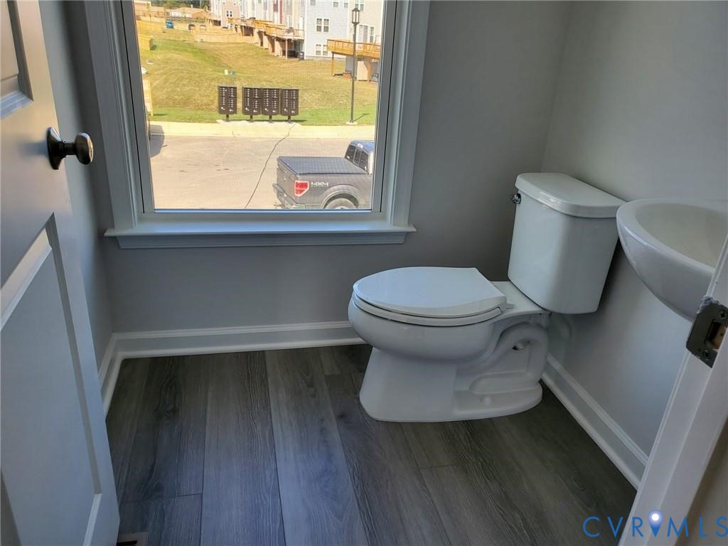 8833 Foxway Ridge Lane Glen Allen, VA 23060 - Photo 10 of 27 a bathroom with a toilet and a sink