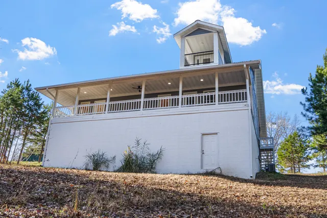a view of outdoor space with wooden floor and windows