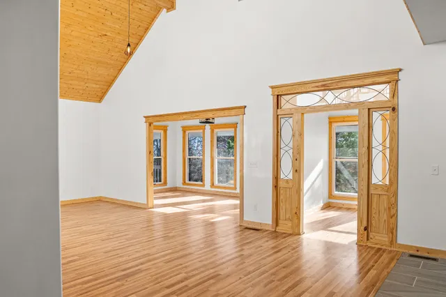 a view of staircase with lots of frames and white walls