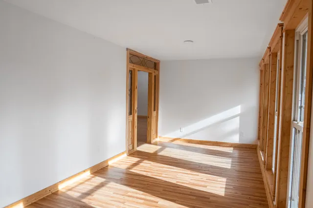a view of a balcony with wooden floor