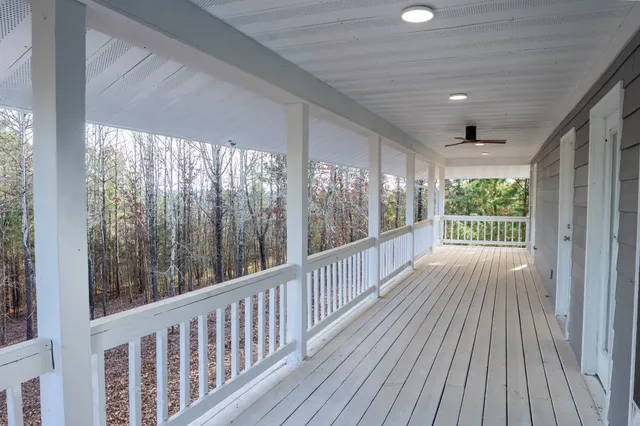 a view of balcony with wooden floor