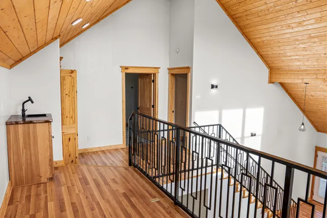 a bathroom with a granite countertop sink a toilet and a mirror