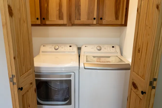 a view of a yard with large trees