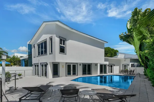 a front view of a house with swimming pool