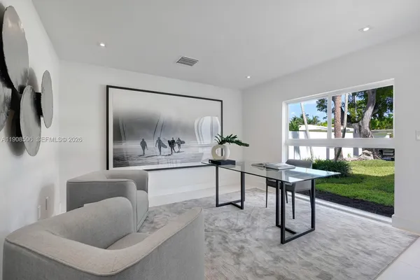 a living room with furniture and a window