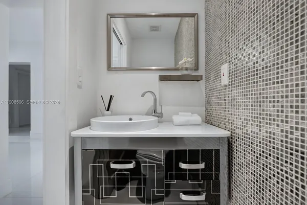 a view of a sink and a mirror