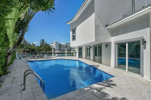 a view of a swimming pool with a lounge chairs