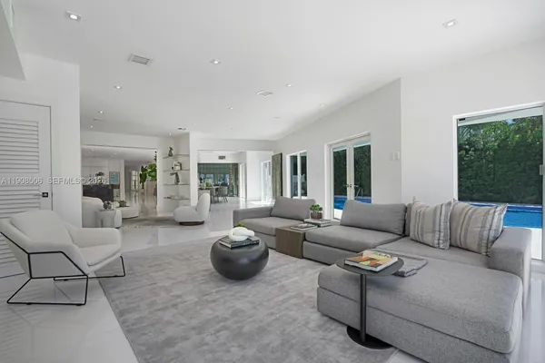 a living room with furniture and a large window