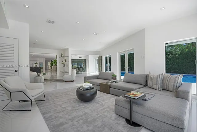 a bedroom with a large bed and a large window