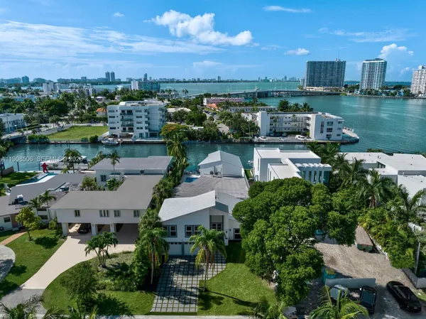an aerial view of a house with a lake view