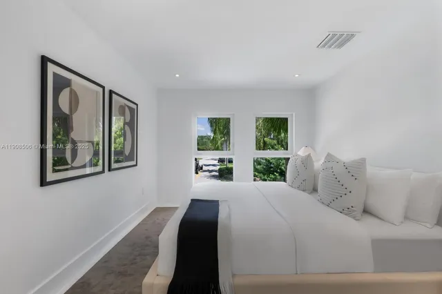 a view of a lake with a table and chairs