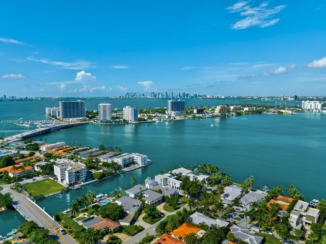 an aerial view of a house with a lake view