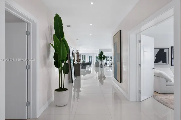 a view of a hallway with living room and entryway