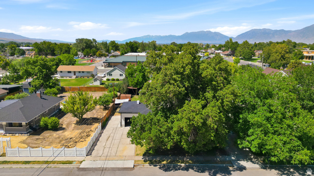 546 West 200 South Payson, UT 84651 - Photo 4 of 45 Aerial perspective showcasing the property with a detached garage, a fenced perimeter, and mature landscaping