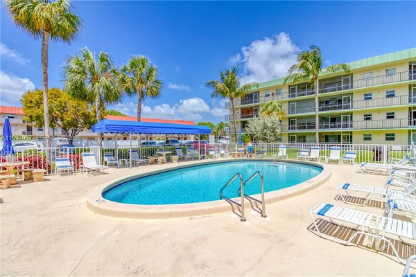 a view of a swimming pool with a patio