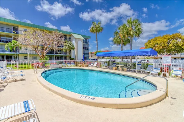 a view of a swimming pool with a patio