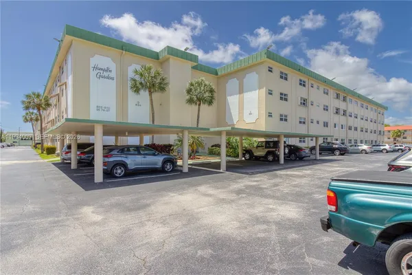 a view of building with truck parked