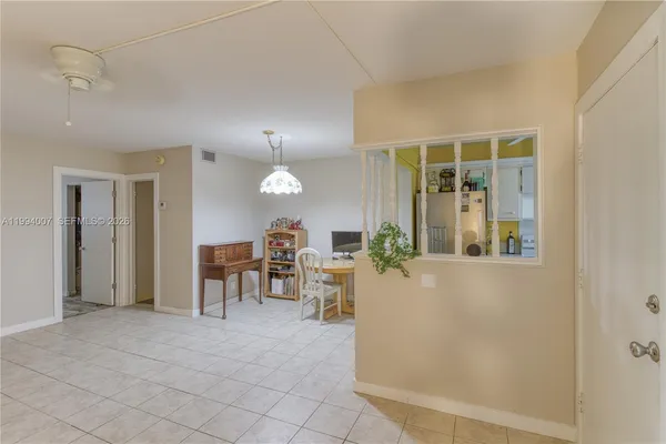 a view of a livingroom with furniture and window